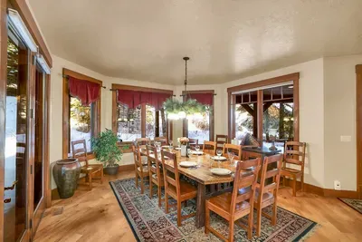 Long dining table with 12 seats so your whole crew can eat together.