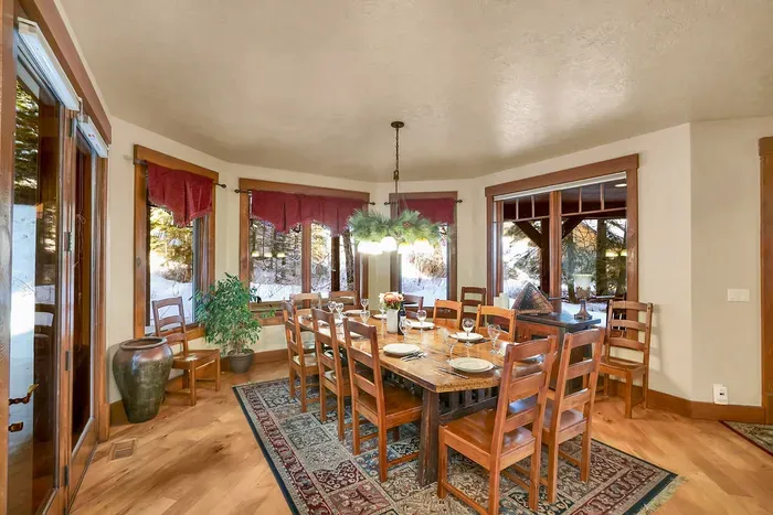 Long dining table with 12 seats so your whole crew can eat together.