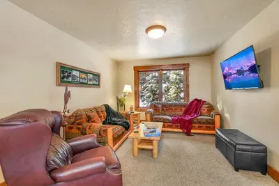 Apartment living area with smart TV—kids’ zone, late-night zone, or quiet zone.