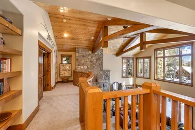 Classic wood-and-stone lodge details—this is a true ski house, not a glass box.
