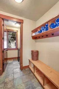 Mudroom made for gear: boots, jackets, helmets, and packs all in one place.
