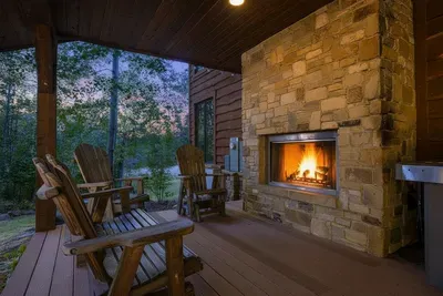 Outdoor wood-burning fireplace on the deck—move the evening outside.