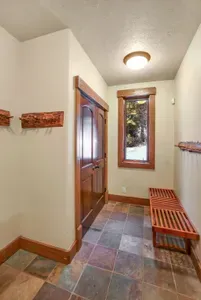 The garage also offers a spacious mudroom, perfect for storing extra gear