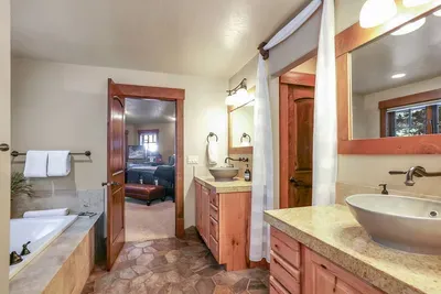 The primary ensuite offers plenty of storage, dual vanities, a walk-in closet, and beautiful finishes