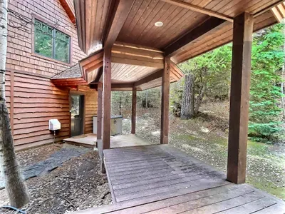 Breezeway connecting main lodge to garage and apartment—easy, dry access.