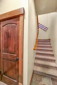 The stairs up to the 1BR/1BA apartment above the garage