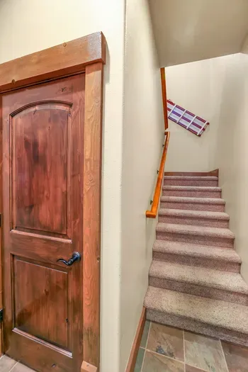 The stairs up to the 1BR/1BA apartment above the garage