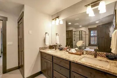 Enjoy dual vanities and ample storage in the primary ensuite