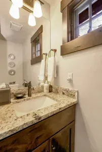 The main floor is equipped with a convenient powder room
