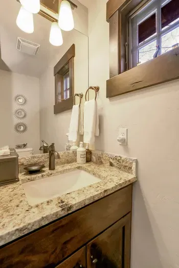 The main floor is equipped with a convenient powder room