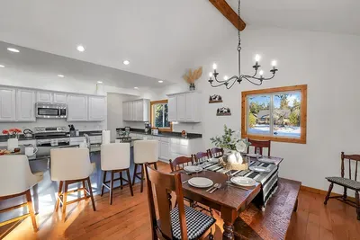 Plenty of counter space and seating for group meal prep, snack stations, and cocktail hour