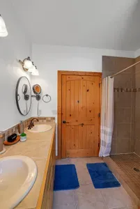 Experience the ultimate in relaxation with the primary ensuite's walk-in shower