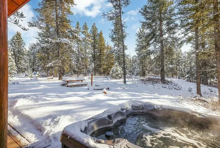 Step out from the primary bedroom straight to the hot tub for a quiet morning soak