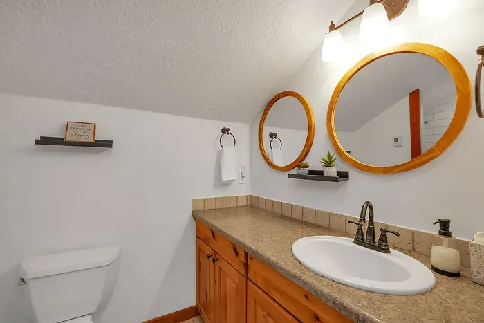 Indulge in the loft's ensuite bathroom, featuring a spacious layout with modern fixtures, perfect for unwinding after a day of adventure
