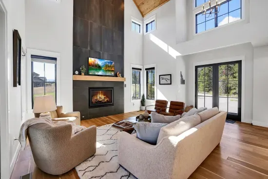 Floor‑to‑ceiling windows bring the outdoors right into your living room