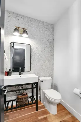 Convenient Half Bath Off the Mudroom: Alpenglow Villa's half bath, located conveniently off the mudroom, offers quick access after outdoor activities.
