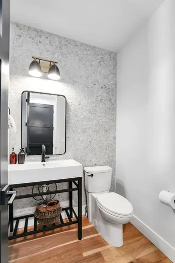 Convenient Half Bath Off the Mudroom: Alpenglow Villa's half bath, located conveniently off the mudroom, offers quick access after outdoor activities.