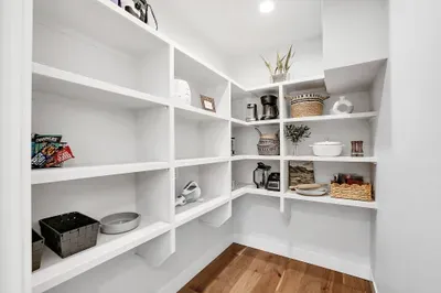 Walk‑in pantry and a wine closet keep everyone’s favorites close at hand and out of the way