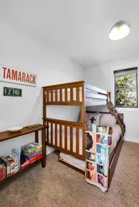 Kids claim the bunk room; adults get the king. Everyone wins. Twin/full with pull-out trundle underneath