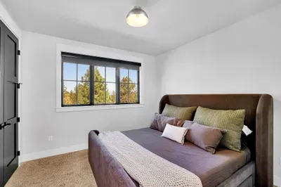 Spacious and Stylish: The king bedroom and its adjacent bathroom offer a blend of style and functionality, with ample space and elegant features for a comfortable stay.