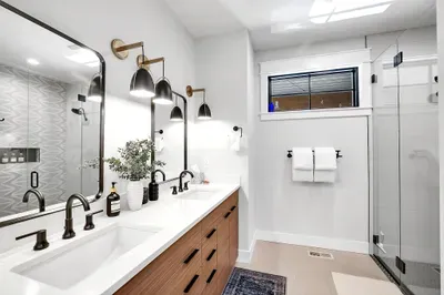 Dual vanities and a walk‑in shower that actually has room for your stuff.