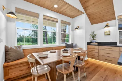 Modern lines, warm wood tones, and vintage-style art give the home the feel of a restored lakeside inn—without sacrificing any comfort.