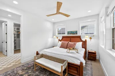 Main-floor primary king suite with ensuite bath offers easy access and privacy—perfect for grandparents or those who prefer fewer stairs.