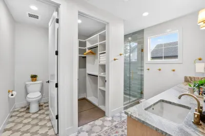 Both primary suites offer generous closets designed for extended stays, giving you true unpack-and-settle-in ease, whether you’re here for a long weekend or an annual family tradition.