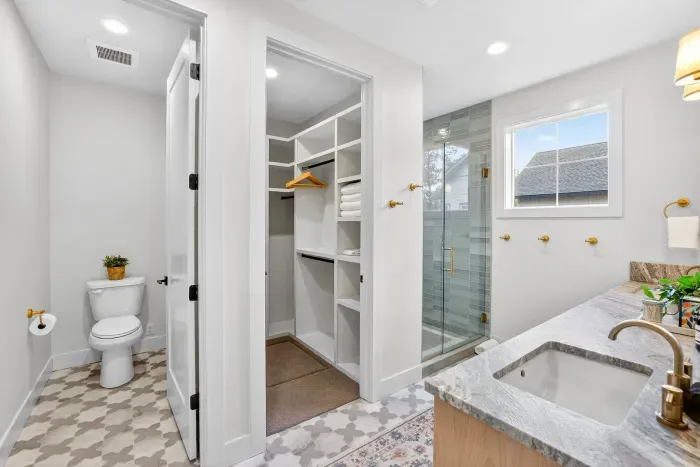 Both primary suites offer generous closets designed for extended stays, giving you true unpack-and-settle-in ease, whether you’re here for a long weekend or an annual family tradition.