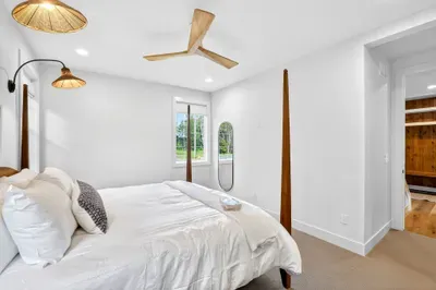 This additional king room on the main level mirrors the primary in comfort and style, so no one feels like they drew the “backup” bedroom.