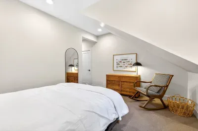 Plush carpeting upstairs keeps the queen bedrooms quiet underfoot, perfect for light sleepers or early risers in multi-generational groups.