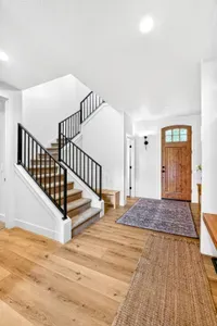 Upstairs, guests will find three queen bedrooms, a custom bunk room, two full baths, and a spacious game loft with pool, ping pong, and a second lounge area—essentially a private “inn floor” tailored for gathering