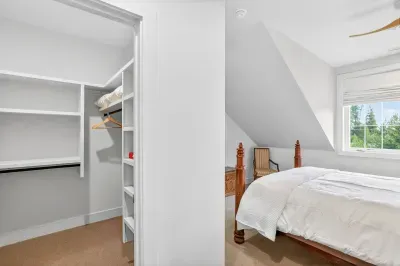 The queen rooms are grouped near two full baths, creating a comfortable “adult wing” that works beautifully for multiple couples traveling together.