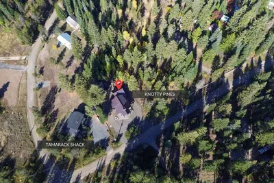 The cabin sits on over half an acre on a quiet dirt road—neighbors nearby, but plenty of space and trees so it still feels like a true cabin escape. Extra bonus--plenty of parking for all of your toys and gear