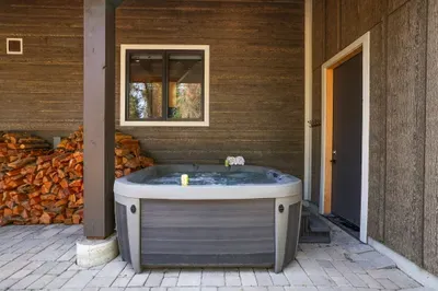 Quick access to the hot tub from the attached garage (firewood available for guest use)