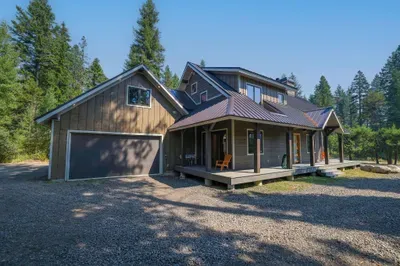 We absolutely love the wraparound deck, which is also accessible from the primary bedroom--the perfect place to enjoy a quiet cuppa in the morning. You'll also have access to the attached 2-car garage