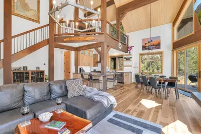 The open concept space is perfect for entertaining, including the loft space featuring two solid wood built-in bunks