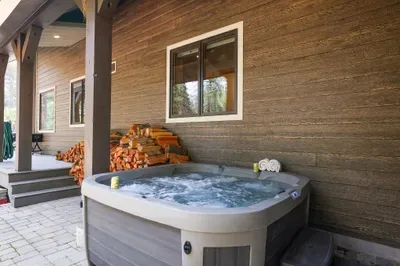 Apres in your own private hot tub after a day on the mountain--firewood is available for guest use