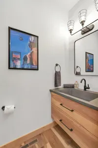 The powder room on the main floor is right off the mudroom