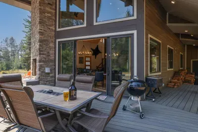 This expansive deck and double sliders greatly increase the living space of Knotty Pines, allowing for seamless indoor and outdoor entertaining. Be sure to make use of the charcoal Weber grill and enjoy an afternoon craft beer from any of our delicious local breweries!