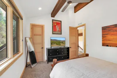 The northern guest bedroom also has a queen bed, as well as a smart TV