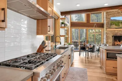 Warm but modern finishes, including the undermount stainless steel sink and cement countertops