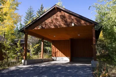You'll have your own detached carport (left side)--the driveway can fit two vehicles