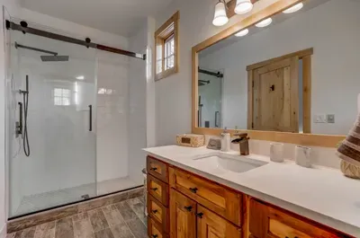 The ensuite bathroom for the secondary bedroom has been beautifully updated with a spacious walk-in shower (rain showerhead)