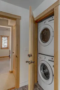 Full-sized washer/dryer combo in the primary ensuite