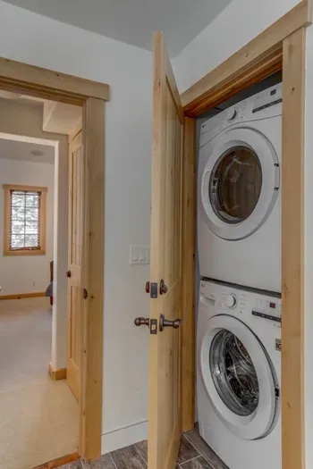Full-sized washer/dryer combo in the primary ensuite