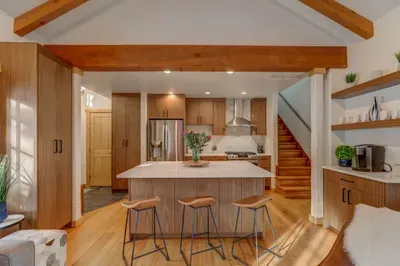 We love the addition of the extra cabinetry--you'll appreciate the extra storage space in this thoughtfully remodeled cottage!