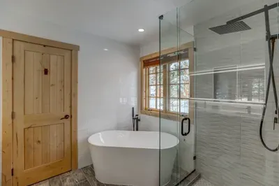 Soak away any sore muscles in the deep soaker tub--the newly tiled walk-in shower has a rain showerhead (we don't blame you if you never want to get out)