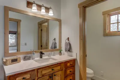 The ensuite bathroom for the secondary bedroom has been beautifully updated with a spacious walk-in shower (rain showerhead)