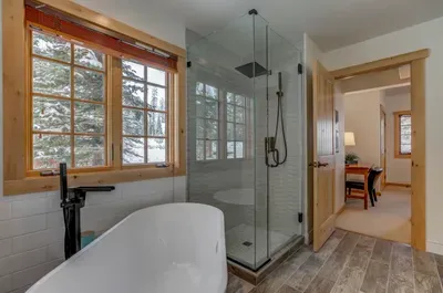 Soak away any sore muscles in the deep soaker tub--the newly tiled walk-in shower has a rain showerhead (we don't blame you if you never want to get out)